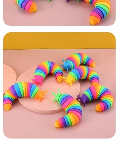 Macro view of flexible rainbow sensory slug toys with articulated joints and vivid colors