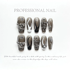 Handmade Gothic press-on nails with 3D silver metal charms and black white flame art
