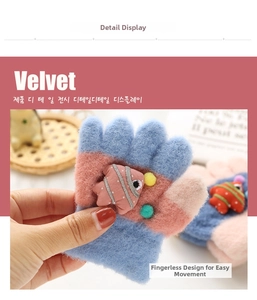 Close-up of thick winter gloves for kids with velvet fabric and cartoon fish detail