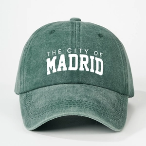 Vintage washed green cotton baseball cap with The City of Madrid embroidery and curved brim