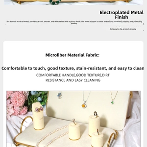 Close-up of golden metal jewelry display stands with soft beige microfiber padding