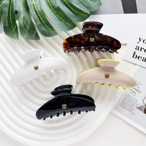 French style acetate hair claw clips with B logo in tortoiseshell white and black