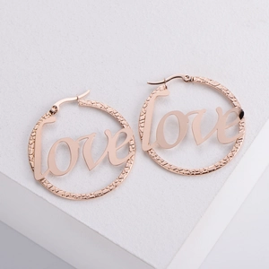 Rose gold plated titanium hoop earrings with LOVE lettering and textured finish