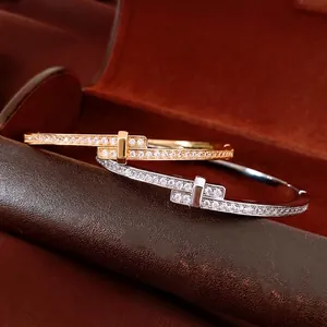 Cross-lock 18K gold plated bangle set with micro-pave crystals in gold and silver