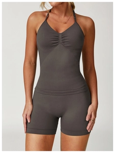 Detail of seamless dark gray yoga vest with flattering center ruching and halter neck design
