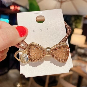 Vintage crystal bow hair tie with champagne gold rhinestones and brown elastic band