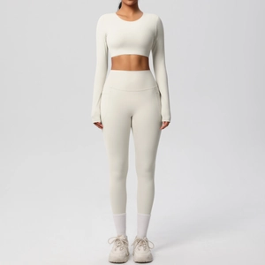 Front view of cream yoga set showing long sleeve crop top and high waist leggings