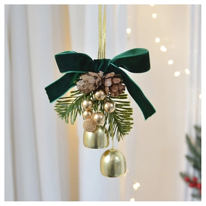 Detailed view of dark green velvet bow with golden bell and natural pine cones decor