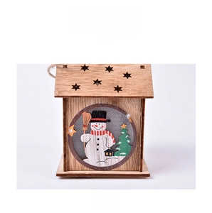 Front detail of wooden Christmas house ornament with snowman illustration and laser-cut star
