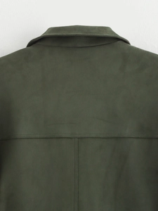 Detailed view of the back collar and shoulder stitching on a dark green suede jacket