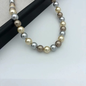 Elegant multi-color gradient pearl necklace with gold, silver and bronze beads