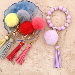 Colorful plush faux fur pompom tassel keychains with beaded silicone wristlet straps