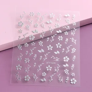Japanese style white cherry blossom nail stickers with floral patterns on pink background