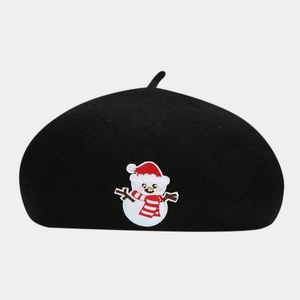 Detail of black wool beret featuring a festive snowman embroidery for winter style