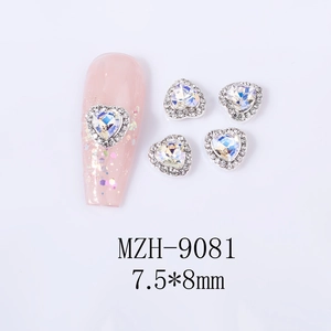 Macro shot of 7.5x8mm heart-shaped nail charm with aurora crystal and silver rhinestones