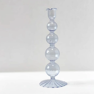 Lavender clear glass candle holder with elegant spherical ripple base on white background