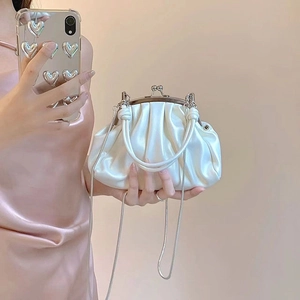 Chic white pleated cloud bag with silver kiss-lock clasp and delicate metal chain strap