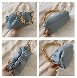 Detailed views of light blue ruched pouch bag with chunky gold chain strap