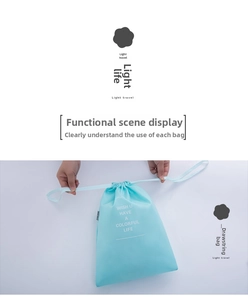 Light blue waterproof drawstring bag for travel storage with decorative white lettering
