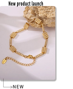 Detail of 18K gold plated stainless steel bracelet with zircon inlaid geometric links