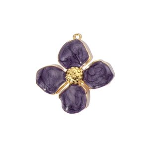 Detail of purple enamel flower pendant with golden edges and marble texture