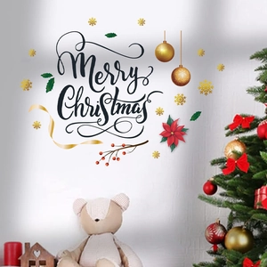 Détail de stickers muraux Joyeux Noël avec poinsettia, feuilles de houx et flocons dorés