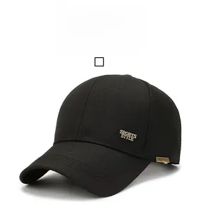 Close-up of black baseball cap side with metal Sports Style logo and woven tag details