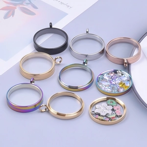 Flat lay of colorful glass floating memory lockets in silver, gold and rainbow finish