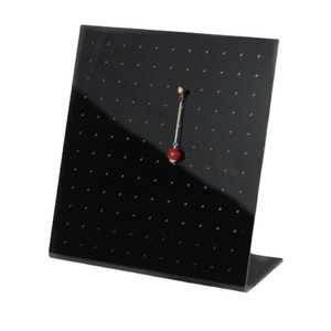 L-shaped black acrylic earring display stand with pendant earrings on white background