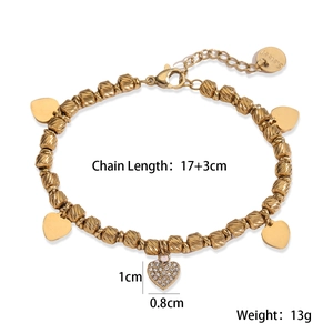Detail of 18K gold-plated stainless steel bead bracelet with engraved heart charm