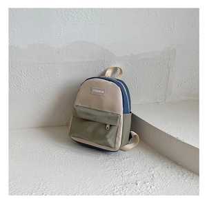 Side view of multi-color canvas backpack for kids featuring stylish color blocking
