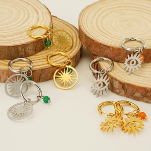 Boucles d'oreilles créoles soleil et œil maléfique en or et argent avec perles colorées