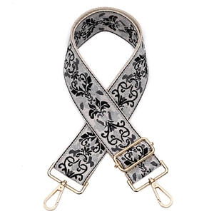 Close-up of vintage vine jacquard pattern on adjustable guitar style handbag strap
