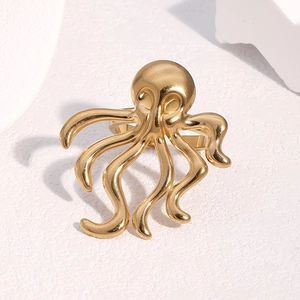 Octopus shaped open ring in 18k gold plated stainless steel on a white background