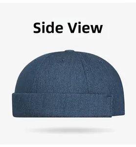 Side view of dark blue denim docker hat with six-panel structure and rolled edge