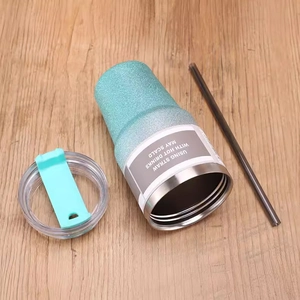 30oz blue-green gradient stainless steel tumbler with transparent lid and straw on wood