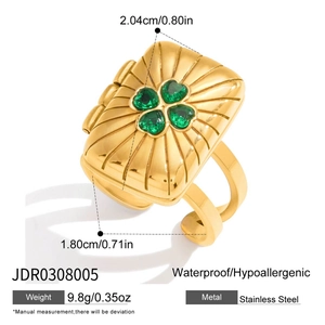 Detailed view of square gold stainless steel locket ring with green clover gemstones
