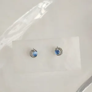Star and moon stud earrings with blue cat eye stone and micro-set cubic zirconia crystals