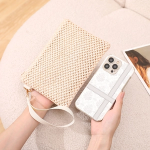 Minimalist straw woven clutch bag for women with wrist strap and smartphone comparison