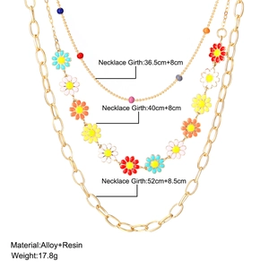 Three-layer retro necklace featuring colorful resin daisies and mixed link metal chains
