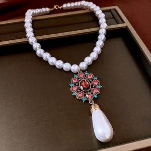 Baroque pearl necklace with vintage gemstone pendant and large teardrop pearl drop