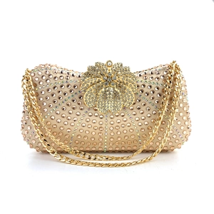 Elegant gold evening clutch bag with champagne rhinestones and metal chain strap