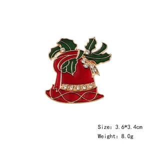 Festive red enamel Christmas bell brooch with green holly leaves and sparkling crystals