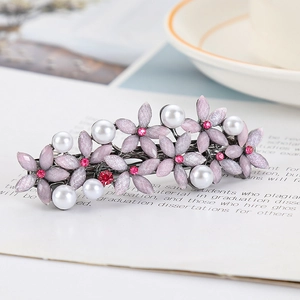 Elegant floral hair clip with pink flower petals, white pearls and red rhinestones