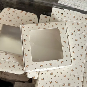 Close-up of floral window paper box with square transparent PVC display for hair accessories