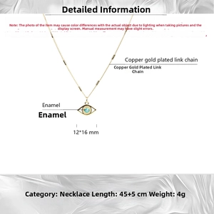 Detailed view of evil eye necklace with blue enamel pendant and gold-plated copper chain