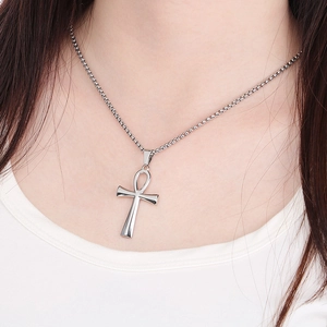 Silver Ankh cross necklace on model neck featuring polished stainless steel finish
