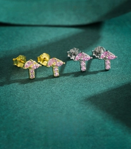 Macro shot of 925 sterling silver mushroom studs with pink marquise zircon stones