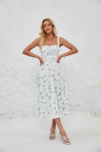 Detail of white floral sundress with side slit and waist tie for a summer look
