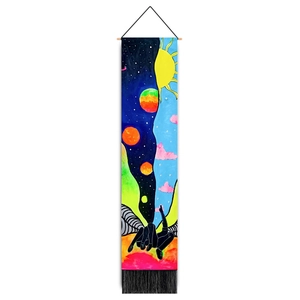 Detail of artistic wall tapestry with celestial pattern, wooden pole and black fringe